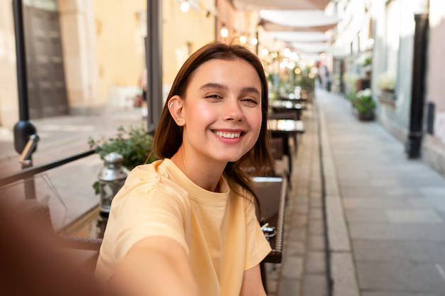 files/medium-shot-smiley-woman-taking-selfie-outside_23-2149557022.avif